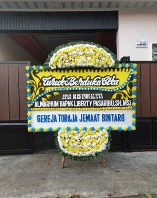 Papan Bunga Duka di Sindutan